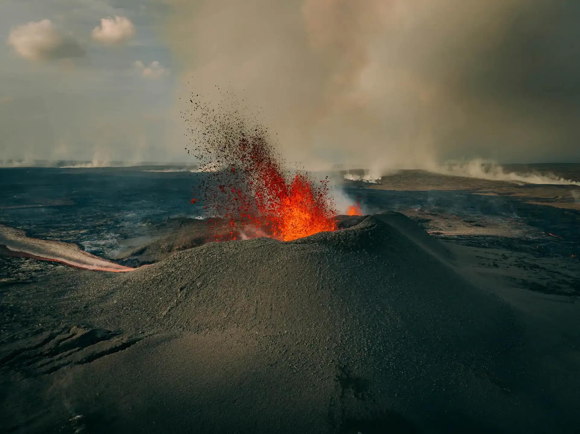 volcano cone and live lava by grindavik