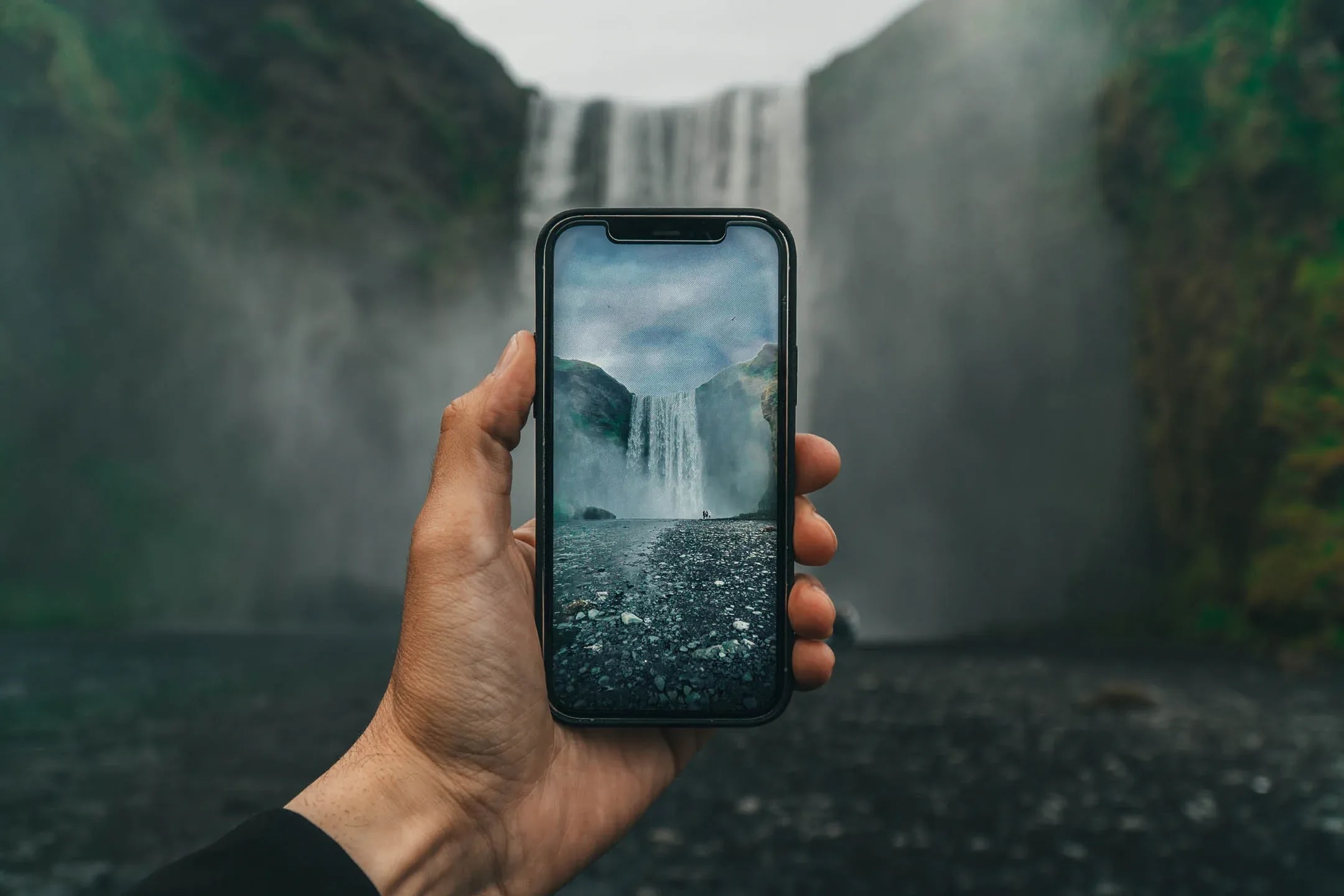 Skogafoss waterfall in Iceland photographed with smartphone during summer the best time to visit Iceland