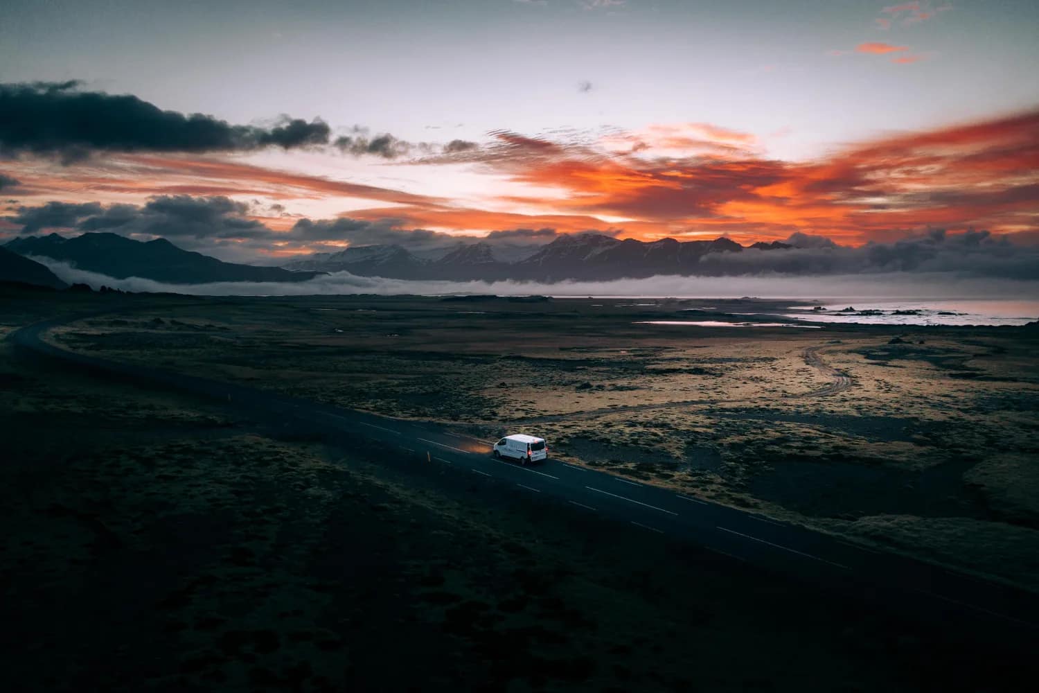 Foxie camper on an Icelandic road at sunset